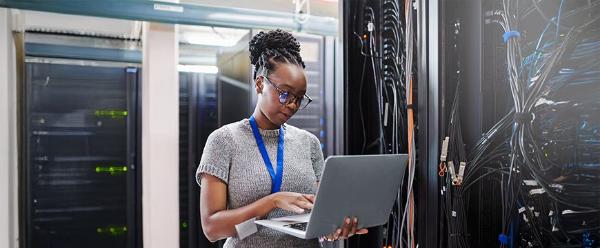 Technician working in a data center